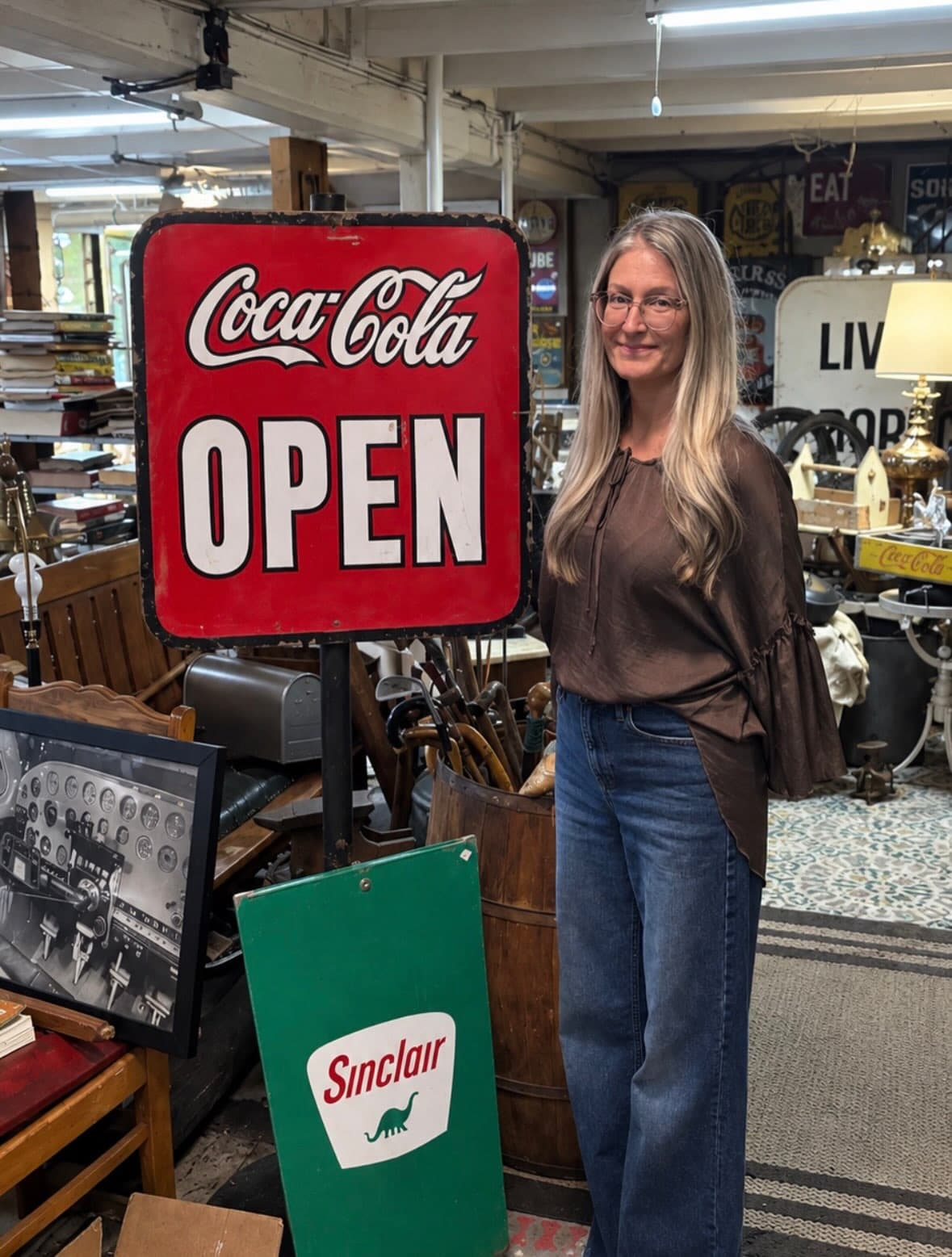 Original Coca-Cola OPEN sign and green Sinclair dinosaur sign inside Vintage Finds Antiques in Wichita, Kansas